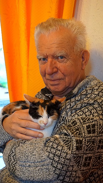 Cat Cuddling with his Senior Owner