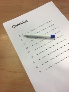 Checklist template with a pen