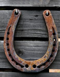 Horseshoe Hung for Good Luck Horseshoe hung above a barn door for good luck